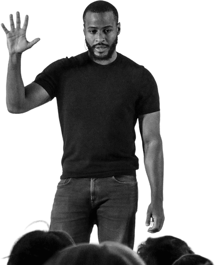 Speaker waving to an audience